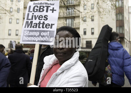 London, UK. 6th Apr, 2019. A protester is seen holding a placard that says LGBTQ lives matter, stamp out homophobia during the demonstration.Protesters gathered outside Dorchester Hotel in London, UK which is owned by the Sultan of Brunei Hassanal Bolkia, to protest and condemn the new anti-LGBT laws brought in by Sultan. Credit: ZUMA Press, Inc./Alamy Live News Stock Photo