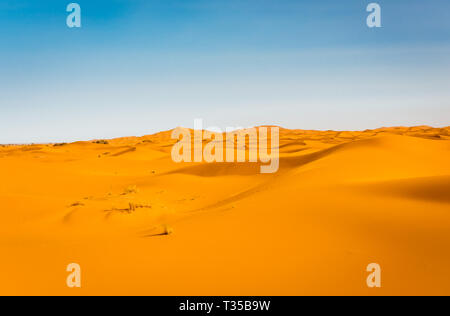 Majestic beautiful scene of Merzouga dunes of Sahara desert Morocco. Stock Photo