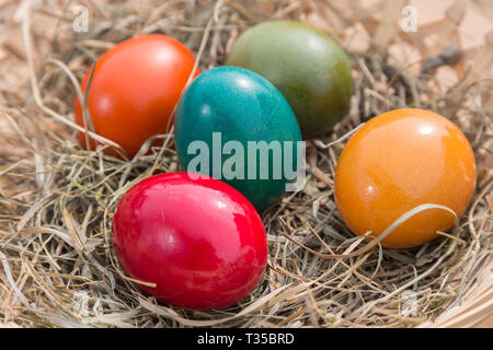 painted easter eggs in a basket Stock Photo