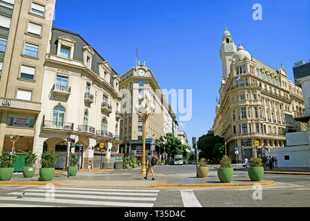 People Walking around Gorgeous Buildings on Diagonal Sur Avenue View from Plaza de Mayo Square of Buenos Aires, Argentina Stock Photo