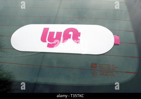 Lyft sticker close up on windshield glass of Lyft drivers