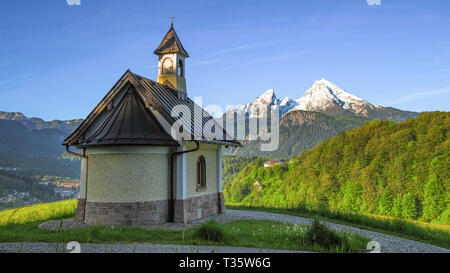 Panoramic spring view beside Berchtesgaden township with mount Watzmann and traditional Kirchleitn chapel Stock Photo