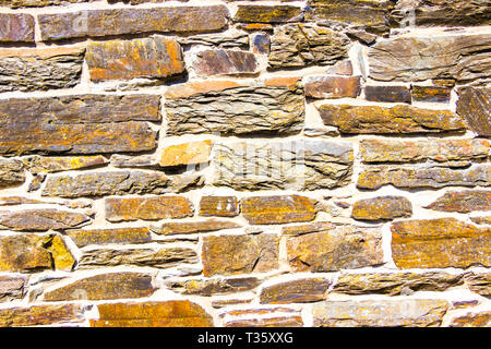 Close up of schist & mortar stone wall texture Stock Photo