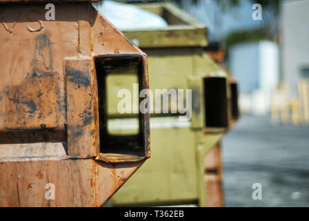 A couple of dumpsters lined up and waiting to be emptied by the trash guy. Stock Photo