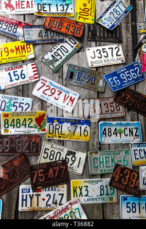 BAR HARBOR, MAINE - JULY 8: Old car license plates on the outside wall in Bar Harbor on July 8, 2013. Stock Photo