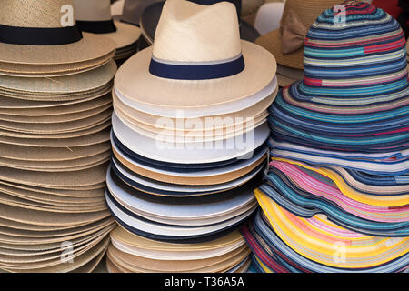 Panama and straw sun hats on display for sale on market stall at the old street market - Mercado -  in Ortigia, Syracuse, Sicily Stock Photo