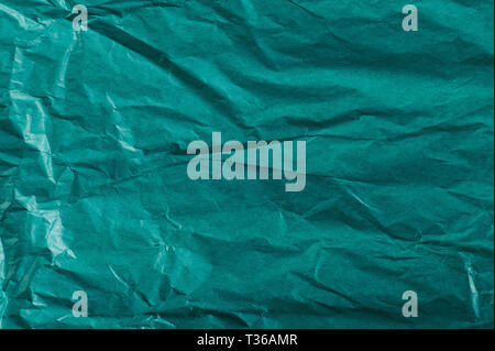 Green packing paper background close up view Stock Photo