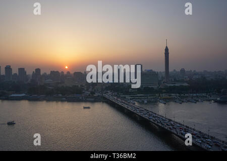 Cairo, Egypt: Cairo Tower and the Qasr el Nile Bridge at sunset. On ...