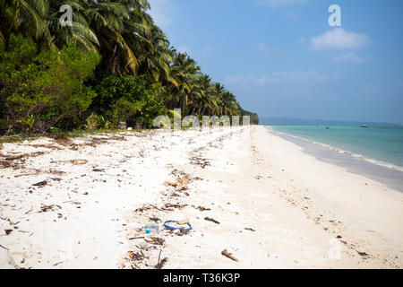 Garbage on the white sand beach of Maldives island. Problem of ecology. bad ecology. Littered beach. garbage on uninhabited Islands the modern problem Stock Photo