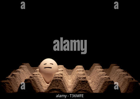 Egg with a disbelieving face. Conceptual image . Copy Space. Stock Photo