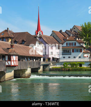 Medieval covered bridge over the Reuss river, buildings of the historic part of the town of Bremgarten, Switzerland. Bremgarten is a municipality in t Stock Photo