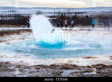 A favorite stop along the Golden Circle is the highly active Geysir Hot Spring Area with boiling mud pits, exploding geysers and the lively Strokkur w Stock Photo