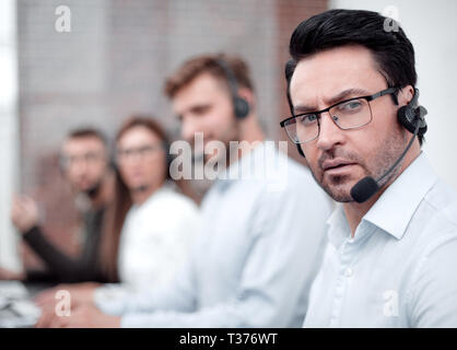 technical support specialist on the background of colleagues Stock Photo