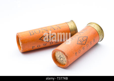 Two old Kynoch ‘Bonax’ 12 gauge paper cased shotgun cartridges with rolled turnover closures loaded with No 10 lead shot pellets. Collecting shotgun c Stock Photo
