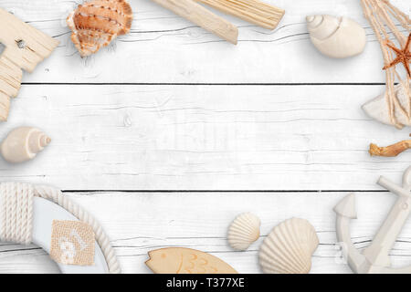 Objects from the sea on a white wooden table. Concept of summer travel with empty space for text. Stock Photo
