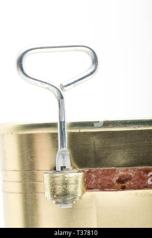 A tin of corned beef bought from a supermarket and partially opened using the key provided. White background. England UK GB. Stock Photo