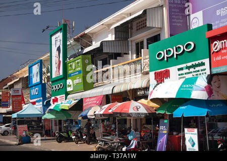 Cambodia, Kampong (Kompong) Cham, town centre, shops in old French colonial buildings covered in signs Stock Photo