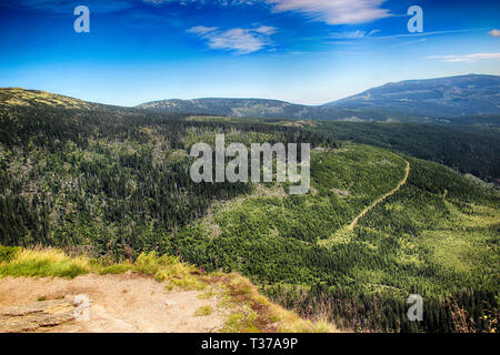 The beautiful view on Valley of river and big waterfall in National park in Giant Mountains in Czech republic. Stock Photo