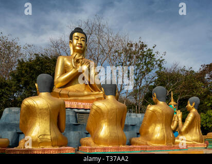 Cambodia, Kampong (Kompong) Cham, Phnom Srey, Kro La Commune, Kampong Siem, Phnom Pros, monastery golden Buddha devotional statue with hands in Vitark Stock Photo