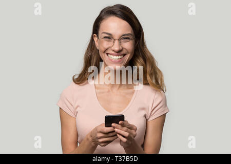 Headshot portrait laughing girl in glasses looking at camera Stock Photo