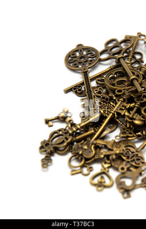 Pile of the old keys isolated on the white background Stock Photo