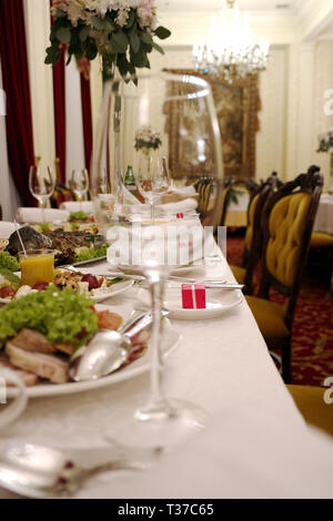 Glasses with wine. Filled with half and stand on the holiday table. selective focus. restaurant Stock Photo