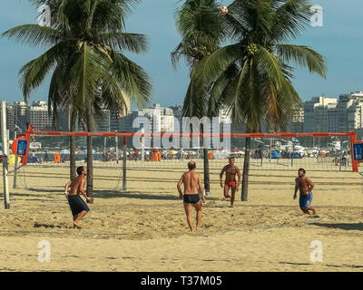 RIO DE JANEIRO, BRAZIL- 27, MAY, 2016: wide shot of a footvolley game on copacabana beach in rio Stock Photo