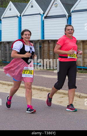 Bournemouth, Dorset, UK. 7th April 2019. Runners take part in the Bournemouth Bay Run on the theme of fun fairy-tale along Bournemouth's sea front – half marathon runners. Participants run to raise vital funds for the British Heart Foundation charity to fight against heart disease. A dry day with hazy sunshine.  Credit: Carolyn Jenkins/Alamy Live News Stock Photo