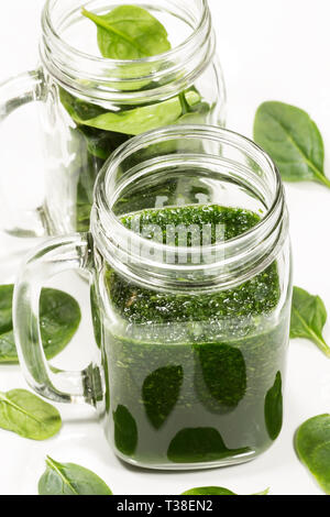 Spinach smoothy in a glass on white background Stock Photo
