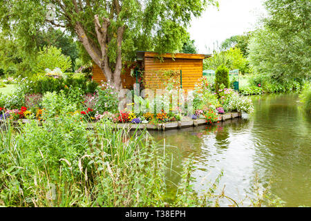 flowery gardens of all colors floating in the spring between the canals, Hortillonnages in Amiens in France Stock Photo