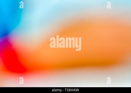 Blur abstract gradient orange, red, purple, blue and white for background artwork. Stock Photo
