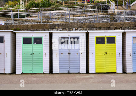 Pictured are beach huts at the Cobb Harbour, Lyme Regis, Dorset. Stock Photo