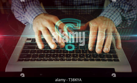 Man typing on laptop keyboard with question mark on hologram screen. Businessman uses computer for internet searching, faq, finding problems solutions Stock Photo