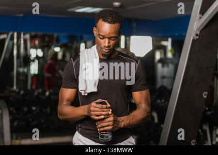 Black African American  young man doing  workout at the gym Stock Photo