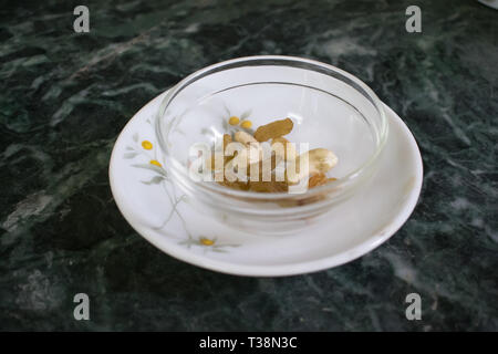 Dry fruits in a glass bowl. Healthy snack. Stock Photo