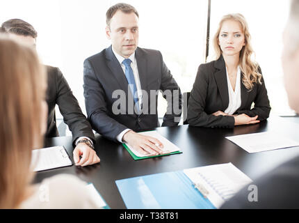 Group of business people discussing with analyzing data financial reports at the office desk Stock Photo