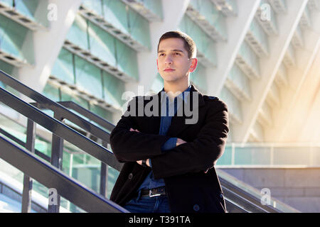 Successful young businessman working outdoors. Business concept. Stock Photo