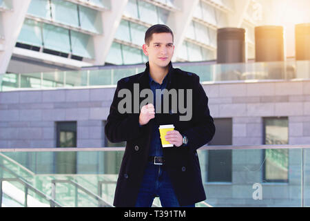 Successful young businessman working outdoors. Business concept. Stock Photo