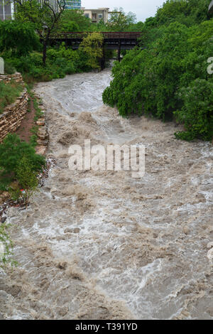 Major storms and heavy spring rains on April 6th, 2019, in central Texas cause heavy flooding to Shoal Creek in downtown Austin. Stock Photo