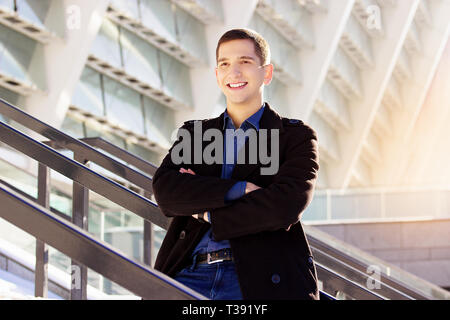 Successful young businessman working outdoors. Business concept. Stock Photo