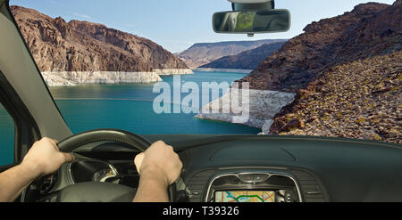 Driving a car with view of Colorado river in front of the Hoover Dam on the Nevada side, USA Stock Photo