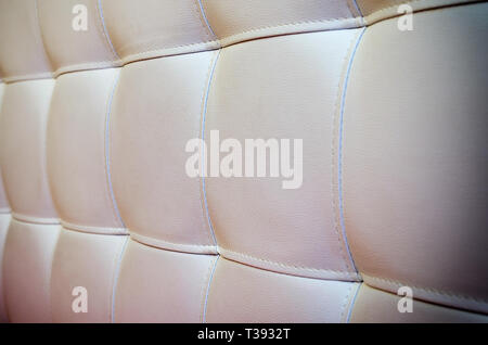 Tufted white leather headboard texture, used for background, photo with vignette Stock Photo