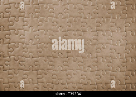 Dark bronze blank puzzle close up. Background and texture Stock Photo