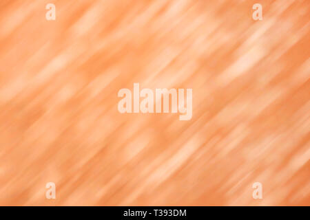 Orange defocused light with diagonal strokes. Abstract background and texture Stock Photo