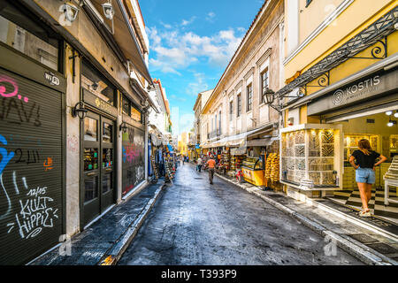 A typical touristy street and neighborhood in the Plaka District of Athens, Greece, with cafes, souvenirs and markets Stock Photo