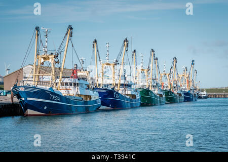 Docked fishing boats in the old port of Oudeschild on the Island of Texel Stock Photo