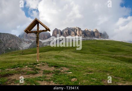 Crucifix on top of the Pordoi Mountain pass in Italy. Stock Photo