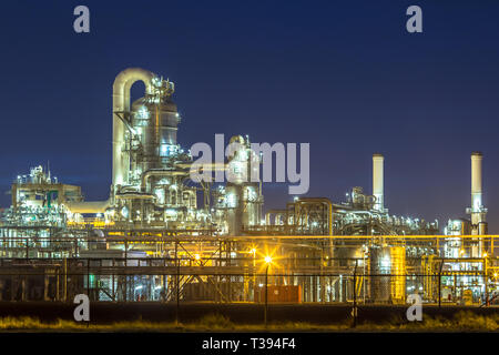 Detail of illuminated petrochemical industry in darkness on Maasvlakte area port of Rotterdam, the Netherlands Stock Photo
