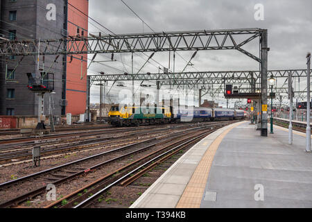 The  2353 London Euston to Glasgow Central Caledonian sleeper train arriving at Glasgow central station after its overnight journey.