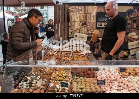 Neuwied, Germany - April 6, 2019: a salesman is selling sweets on the Chocolate Festival Stock Photo